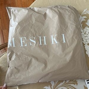 Beautiful NEVER opened white dress with bow from Meshki